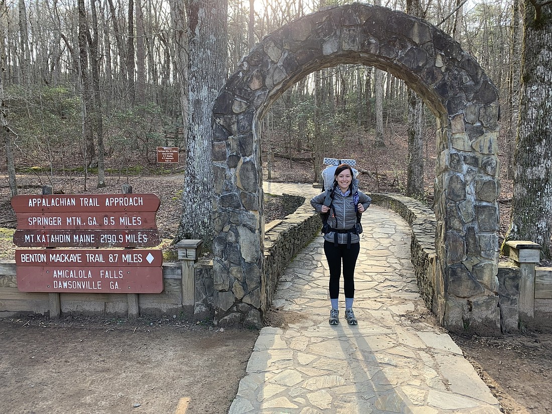 Tatum Temple stands under the arch at Springer Mountain in Fannin County, Ga., which marks the start of the Appalachian Trail. Photo courtesy Tatum Temple.