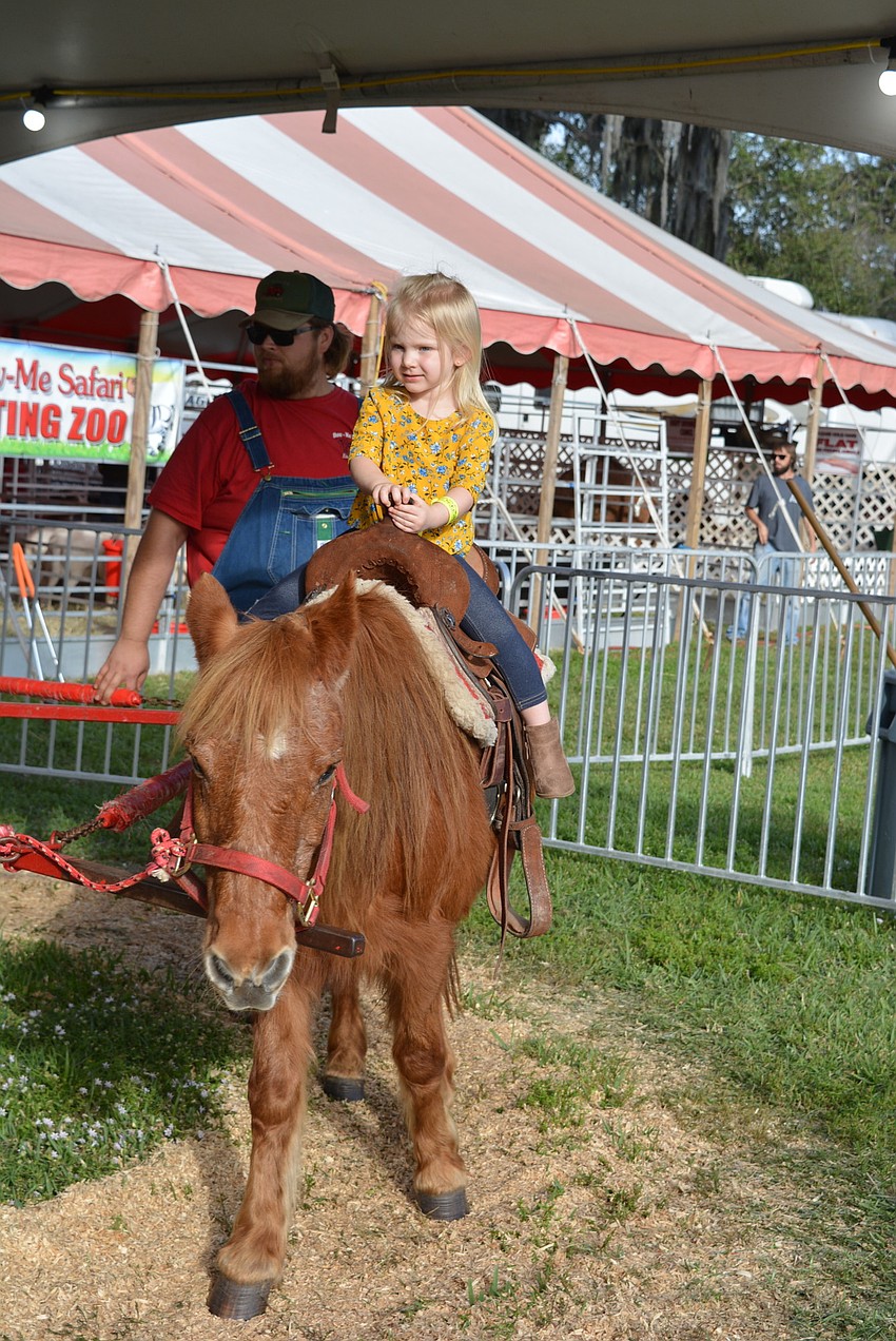 Palmetto 3-year-old Madison Brissette loves every chance to ride a pony she can get.