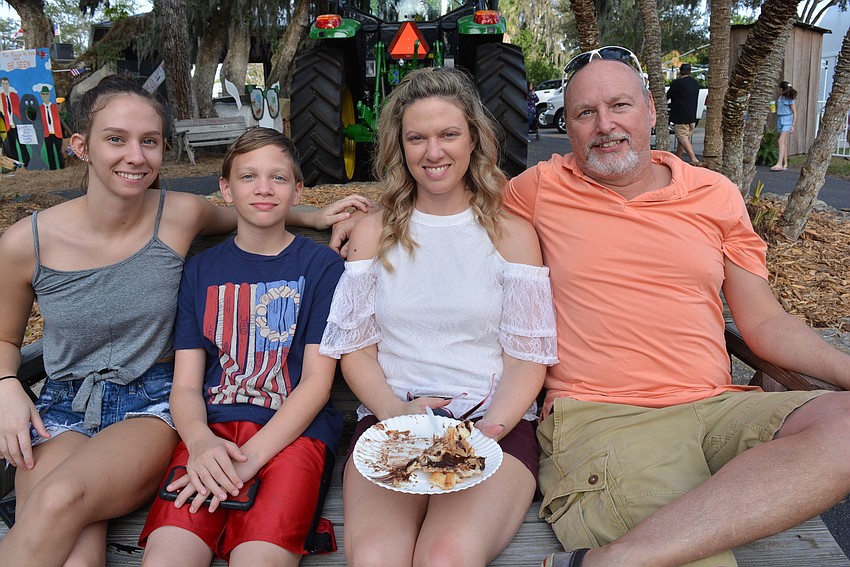 Heritage Harbour's Ryanna, Drake, Tessa and Gary Rice watched pig races and the Paul Bunyan Lumberjack Show before feasting on an eclair elephant ear.