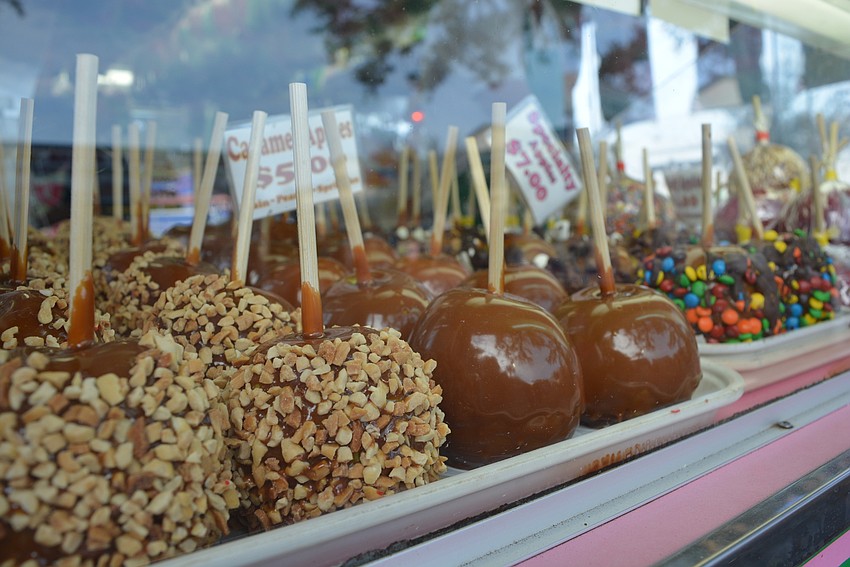 Guests enjoy a variety of fair foods, from caramel apples to funnel cakes, grilled sausages and more.