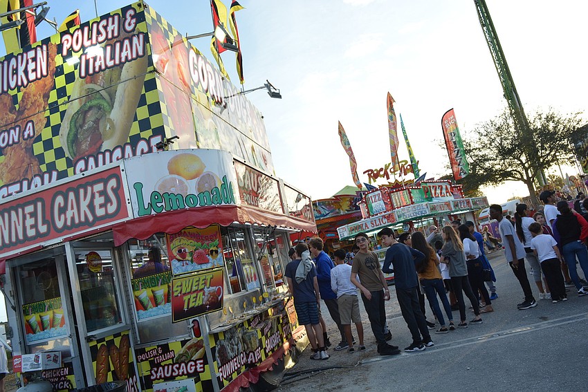 Fair-goers could enjoy carnival food, games and rides on the midway.