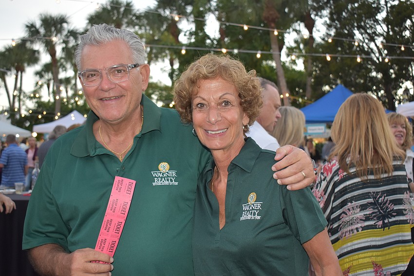 Wagner Realty's Jerry and Kathy Zaferatos sell raffle tickets.