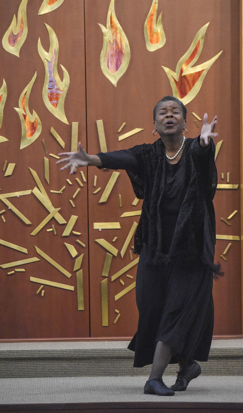 Lonnetta Gaines performs an interpretive dance to 