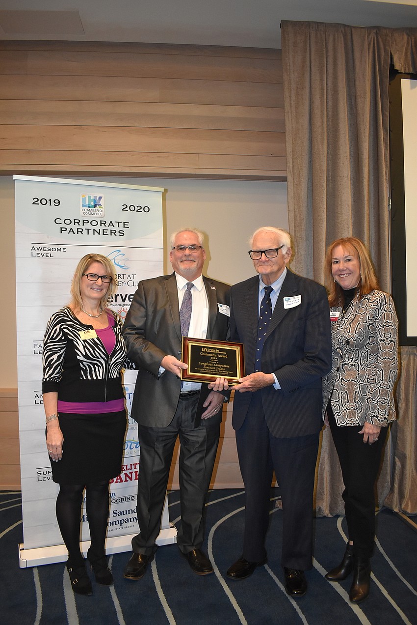 Tonya Atchison with Chairman's Award winners Jimmy and Jim Seaton and Robin Lankton.