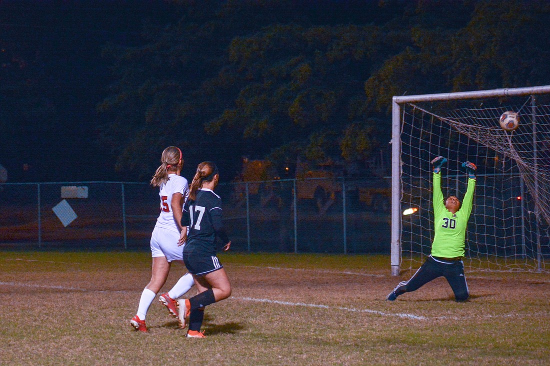Sailors junior Annette Zamsky watches her shot go over the head of a Palmetto goalkeeper.
