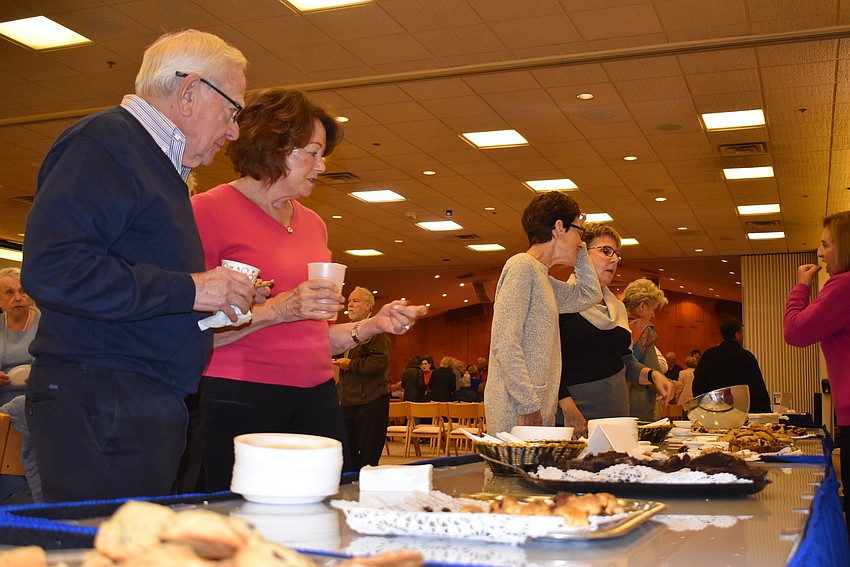 Homemade cakes and cookies brought attendees to the social hour.