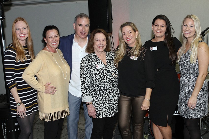 Board members Emma Kate Silvestri, Liza Kubik, Mike Harb, D'Arcy Arpke, Vice President Nikki Logan Curran, Executive Director Sarah Firstenberger and Event and Community Outreach Director Veronica Clinton.