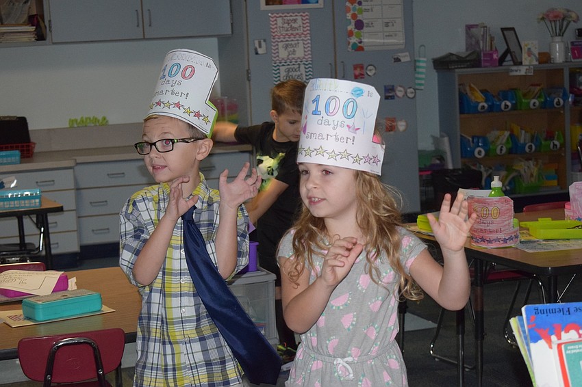 Kindergartners Liam Ten haff and Serenity Cardwell dance as monsters while counting to 100.