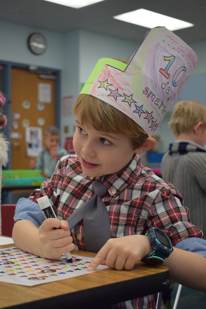 While wearing a hat that says, 