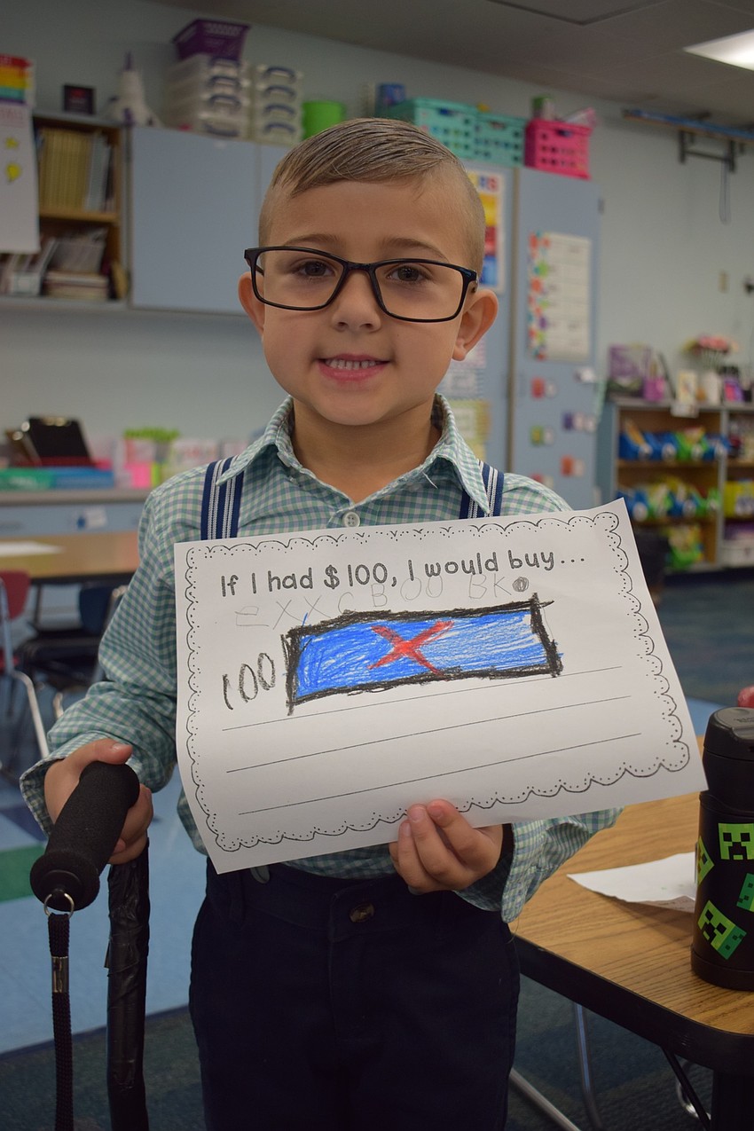 If kindergartner Becks Barnett had $100, he would buy an Xbox because he likes playing video games.