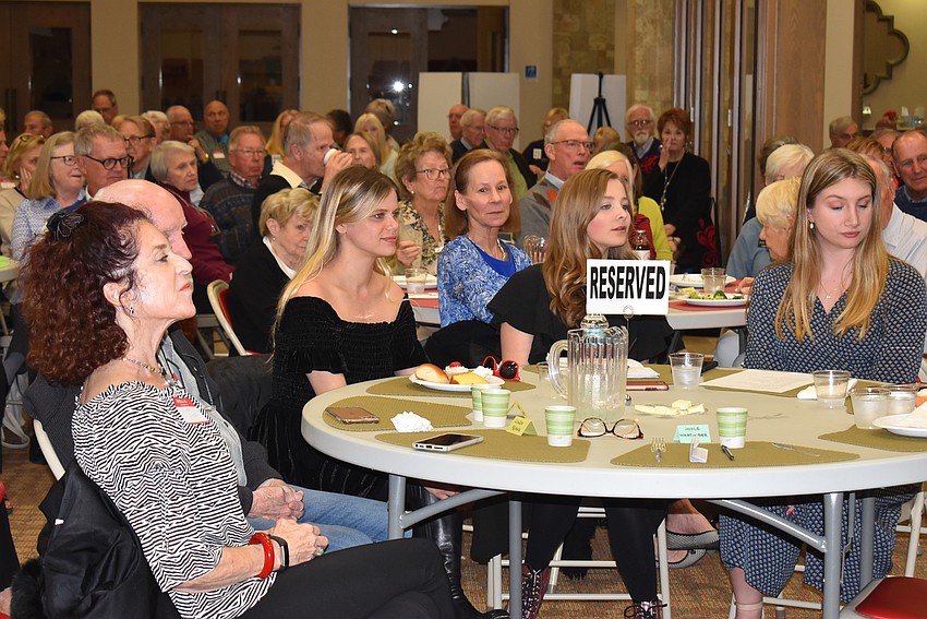 During Silverman's solo piano performance, supporters snapped photos.