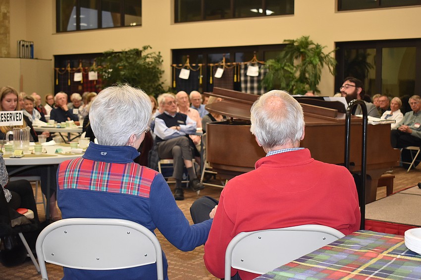 Joyce and Bill Wartinbee hold hands while watching the performance.