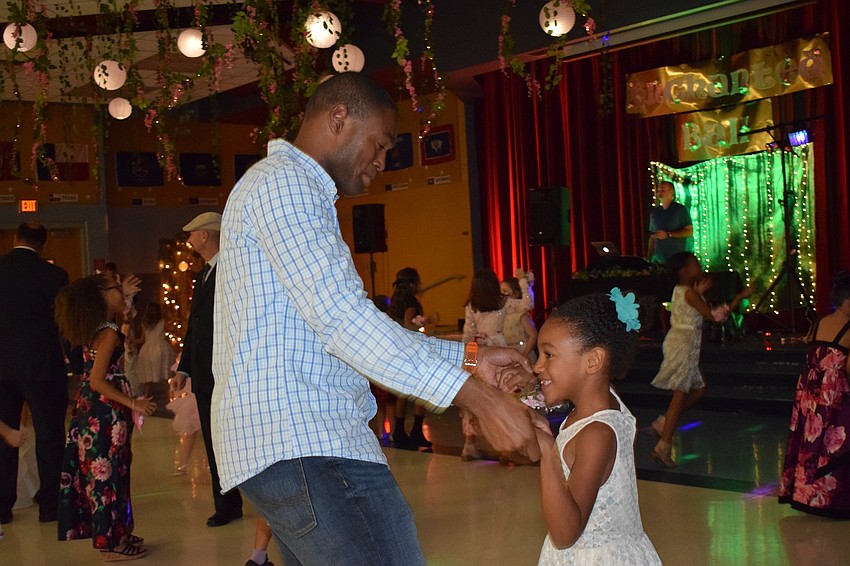 Kelvin Hearns dances with his daughter, Caydence, a kindergartner. Kelvin Hearns says his daughter was dancing before they even arrived at the father-daughter dance.