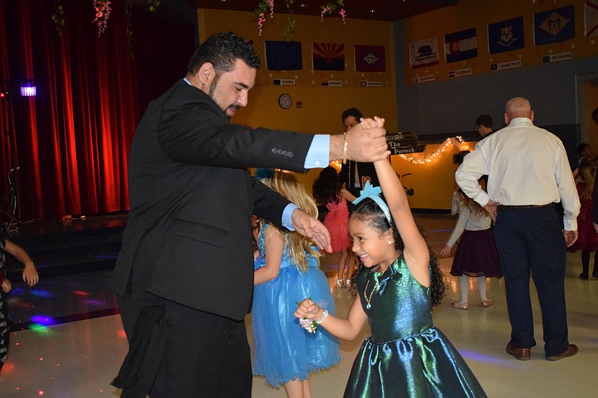 Luis Tejeda and his daughter Aryanna enjoy their first father-daughter dance. 