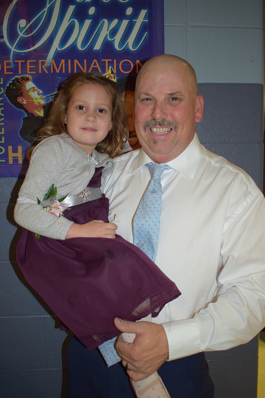 Macie Anderson, a pre-kindergartner, loves dancing with her dad, Kenny, during their first daddy-daughter dance. 