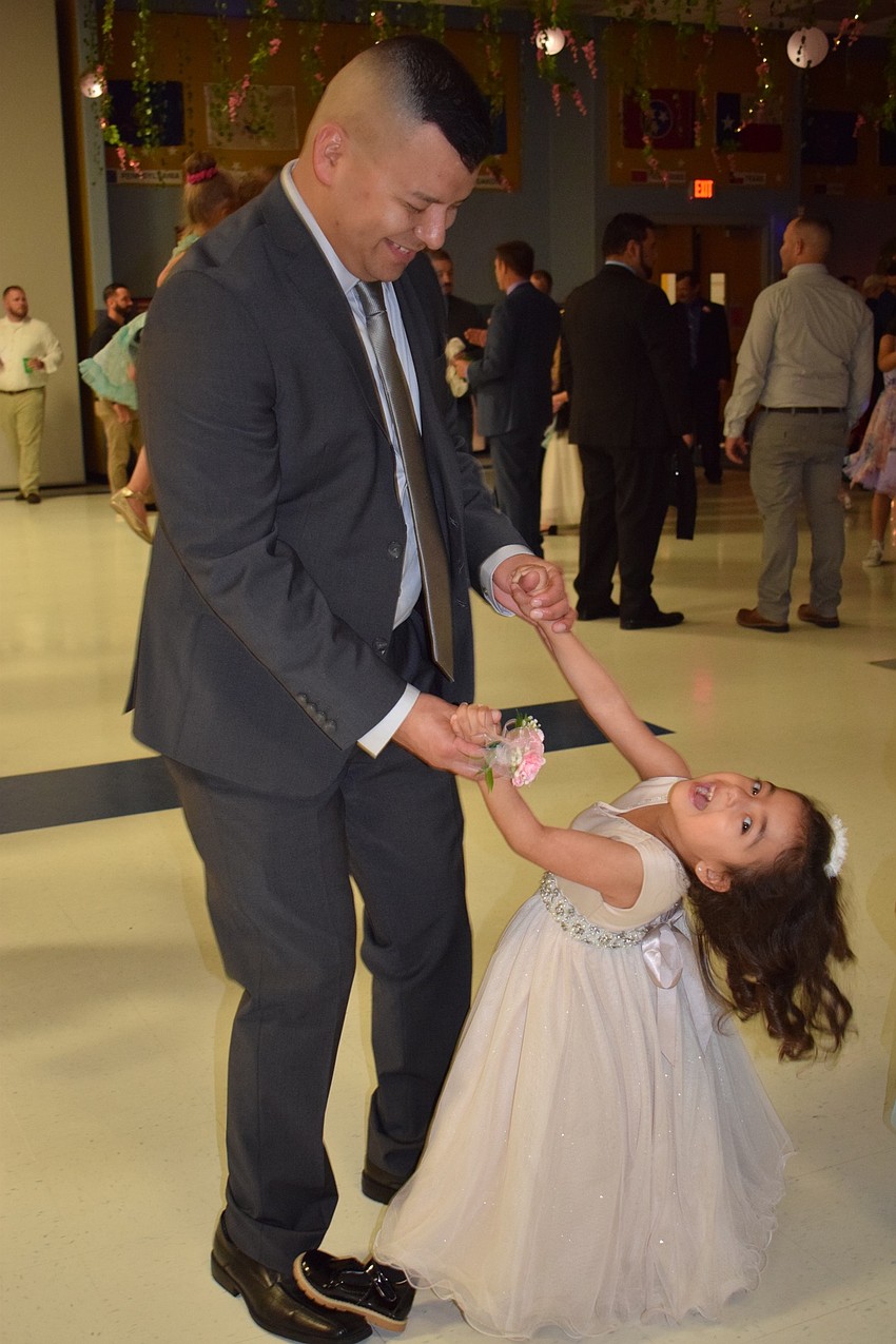 Pedro Zamora has fun dancing with his daughter Abigail, a pre-kindergartner. 