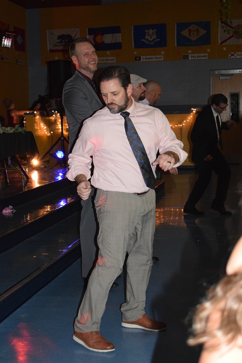 James Trotter busts a move during the dad's dance competition, which he won. His daughters, Leah and Julia, says he embarrassed them. 