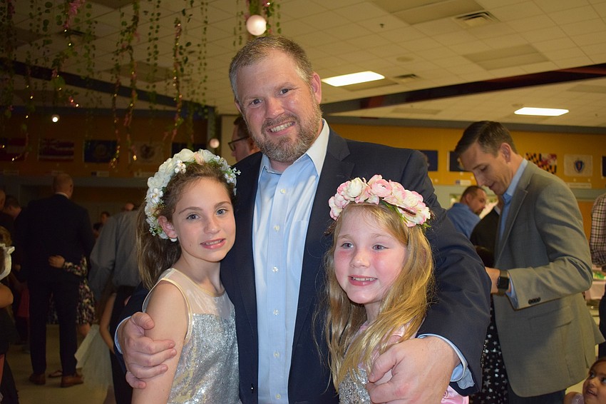 Rebecca, Richard and Addison Creel dance together. 