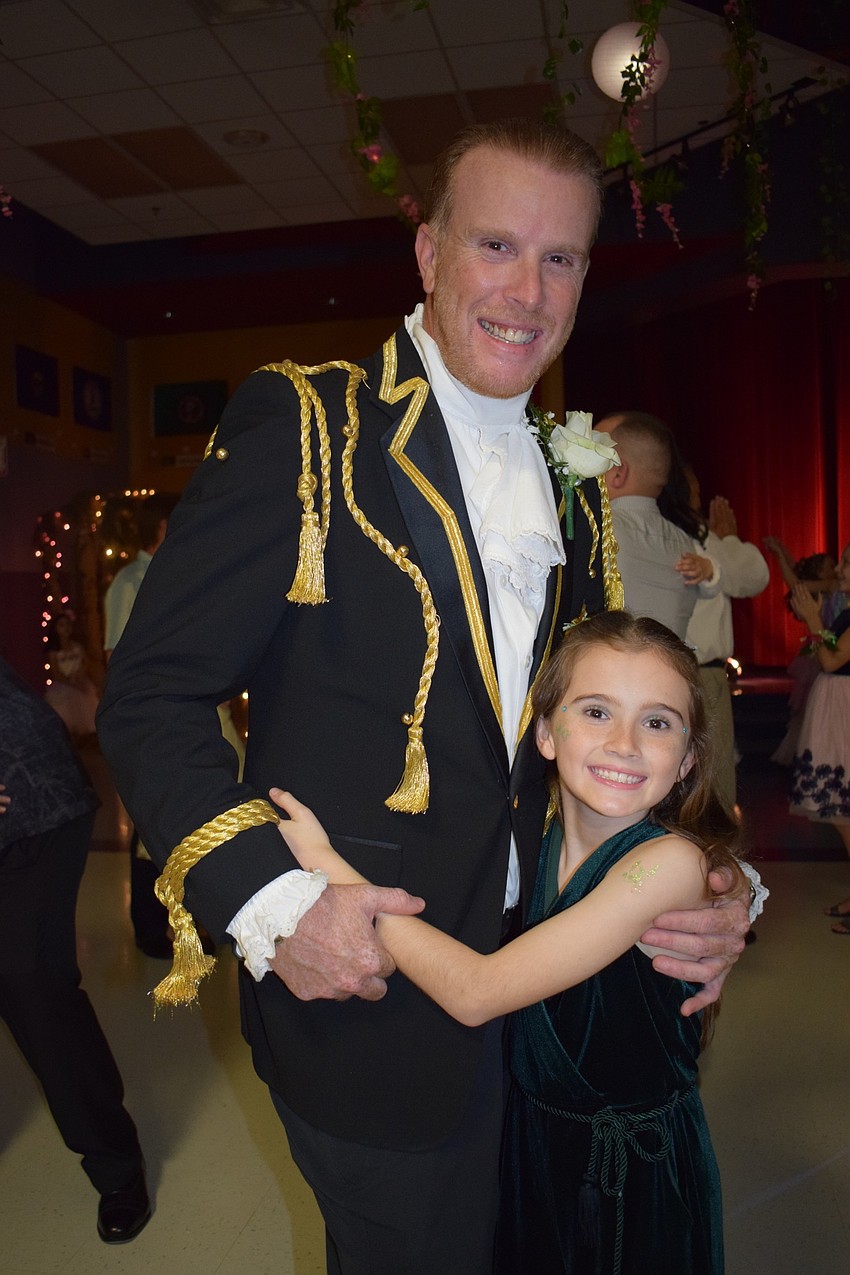 Dressed as Prince Charming, Rob Commissar tries to dress to the theme to make the dance more memorable for his daughter Sky, who is a third grader.