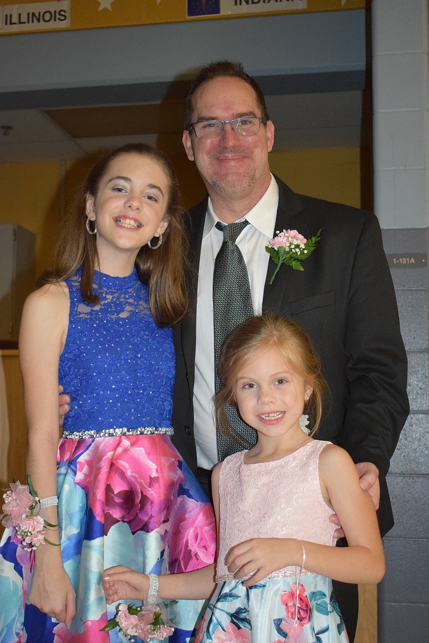 Edan, Matt and Allison Armistead spend time together during the daddy-daughter dance. This year is the only year Edan, a fifth grader, will be at the same school as Allison, a kindergartner.