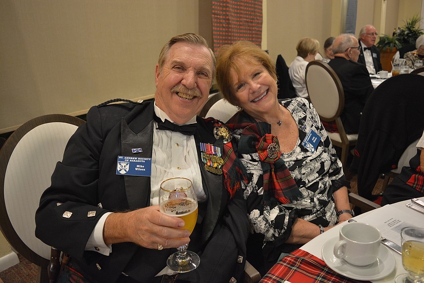 Greenfield Plantation residents Mike and Jody Wilcox like the toast to the lads and lasses the best.