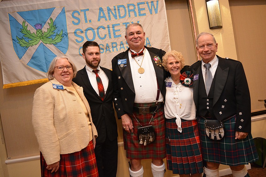 Palm Aire's Mary Lou Morris, her son Andrew Morris and husband Capt. Carl Morris join husband-and-wife Mary Ellen MacMahon and Frank MacIntire, who represented the Caledonian Club of Florida West.