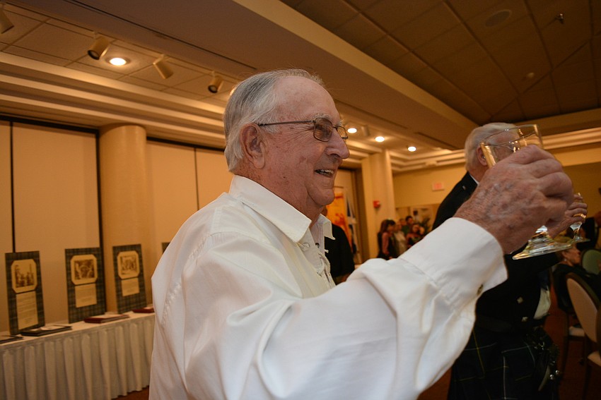 The Meadows resident Paul Campbell lifts his glass for the 