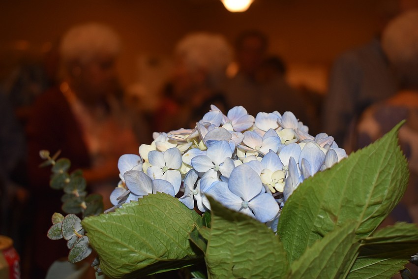 Hydrangeas decorated tables where residents gathered to chat.