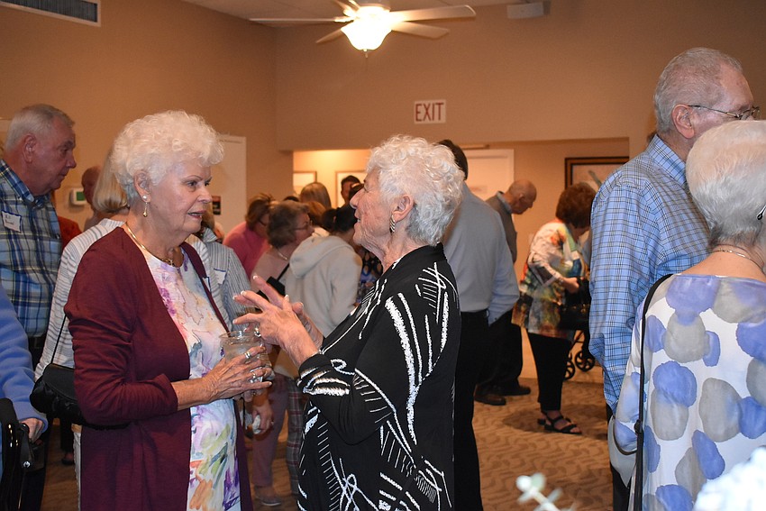 Residents mingled in the packed clubhouse.