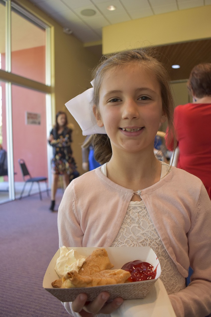 Lily Light, 9, enjoys her blintzes.