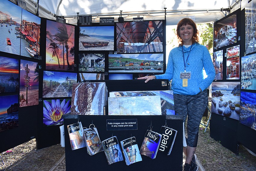 Gail Horn stands with her aluminum art.