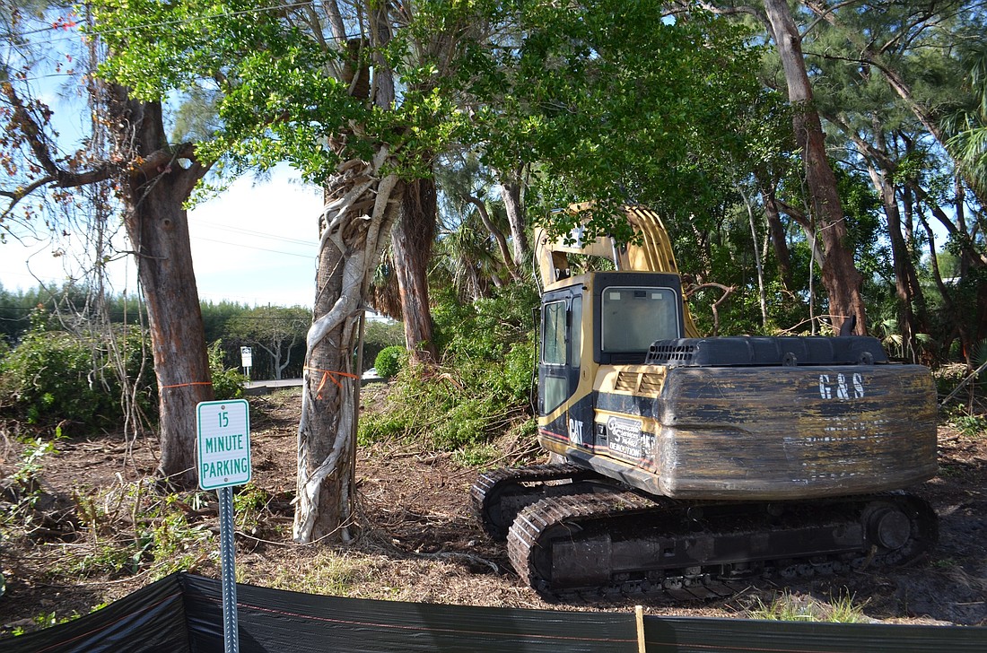 Work is underway near the intersection of Broadway Street and Gulf of Mexico Drive on the Chiles Group&#39;s parking lot/small office complex.