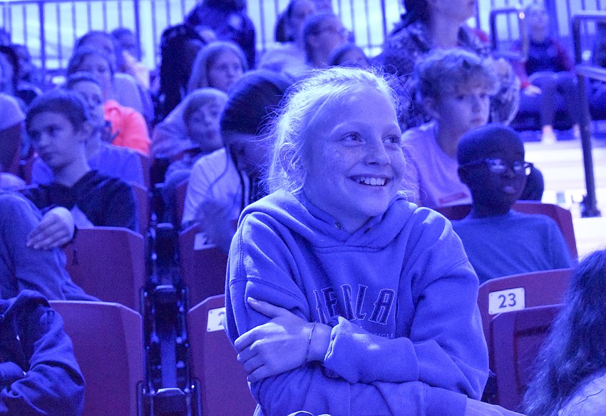 Ava Fleming, 10, sits on the edge of her seat as she watches the circus machine in action.