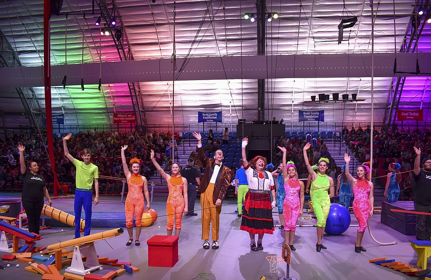 The performers wave goodbye as they take their final bow.