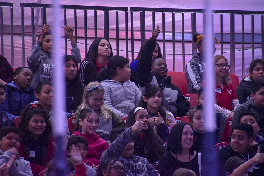 Gocio Elementary School students cheer Bucky the Clown on.