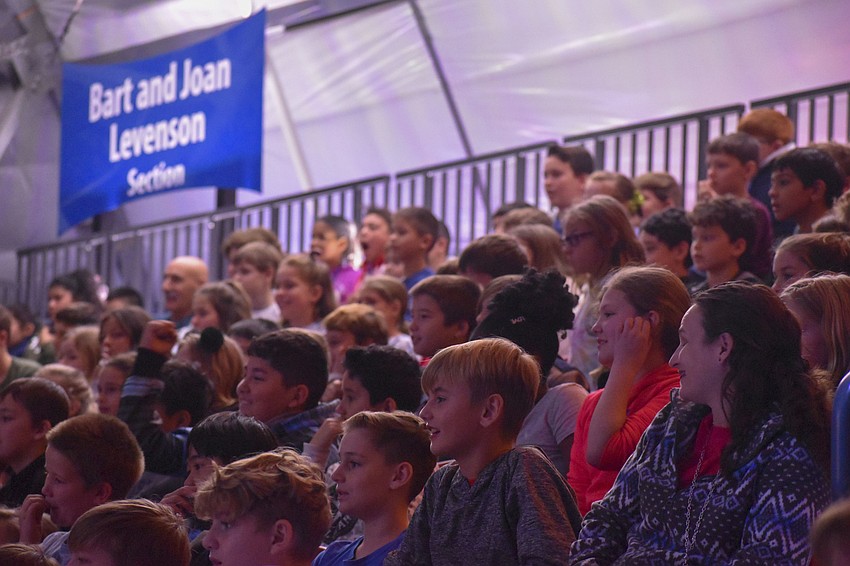 Students watch intently as the performance begins.