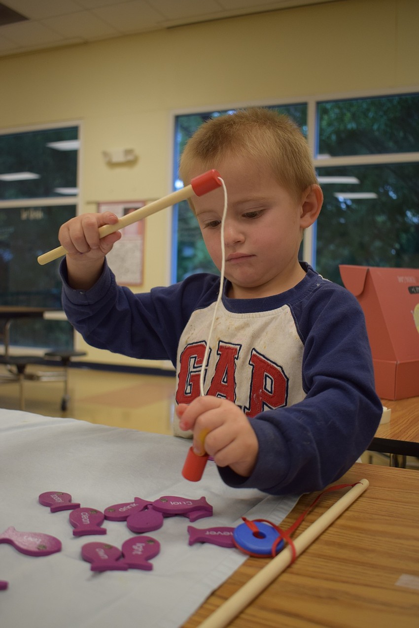 Winston Walauskis, who is 3 years old, fishes for words.