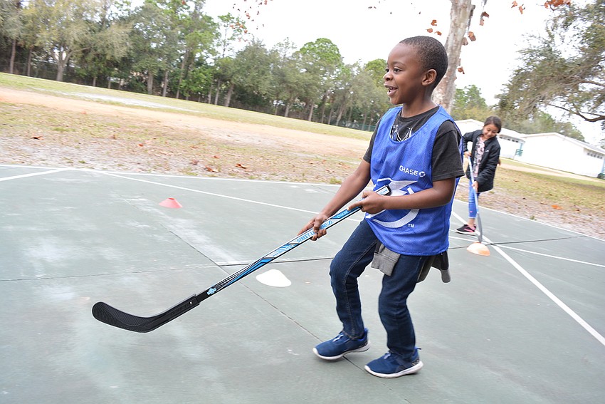 Second grader Terrance Bell says controlling the ball is harder than he expected.