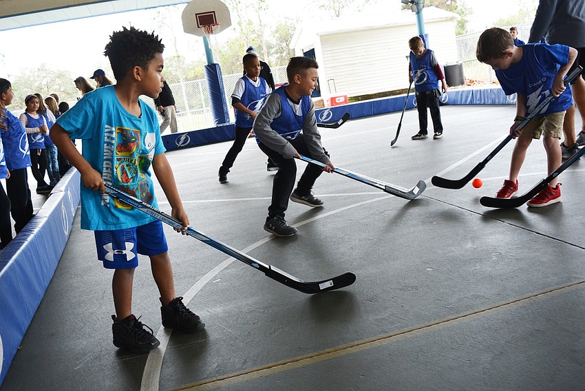 Second grader Luke Levasseur, left, waits for a chance for the ball as a scrimmage match begins.