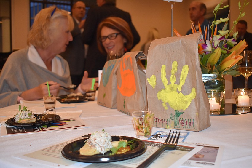 Students from Saint Martha Catholic School baked banana bread and stamped the bags with their handprints to give out to attendees.