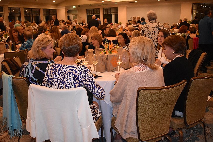 Attendees found spots at various tables to sit and snack