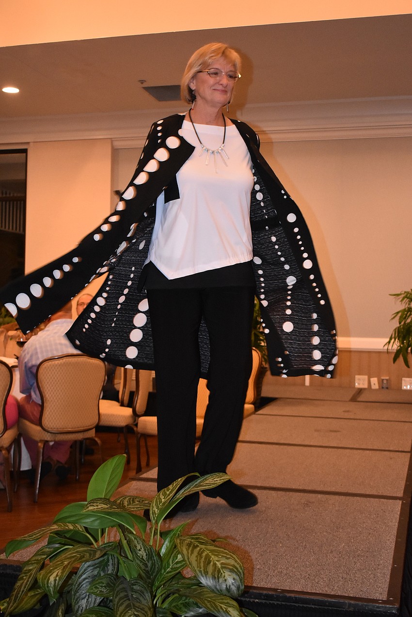 Lynn Christensen twirls in her sweater.