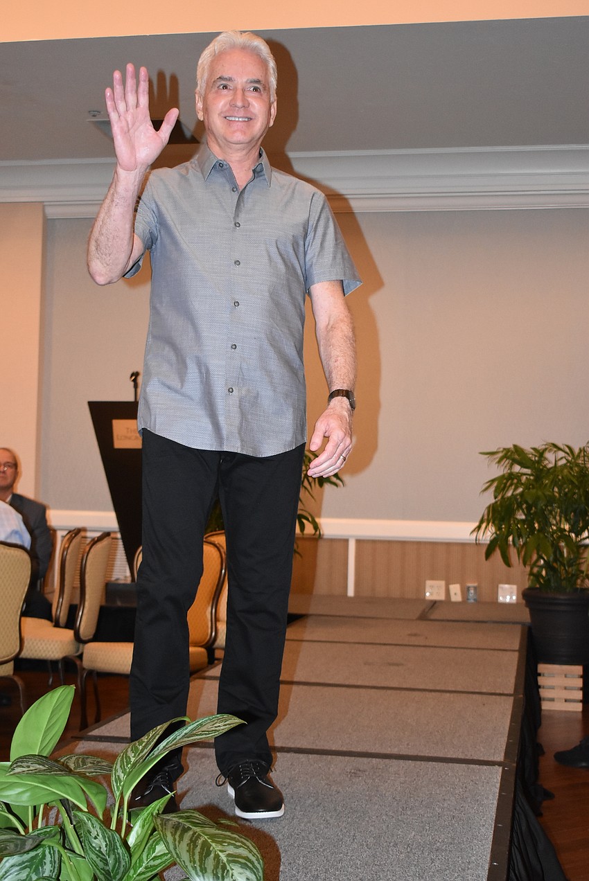 David Pilston waves to the crowd.