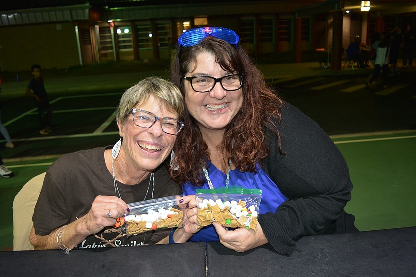 First-grade teachers Nancy King and Tammy Peters sell their s'more trail mix to raise funds for first-grade teachers.