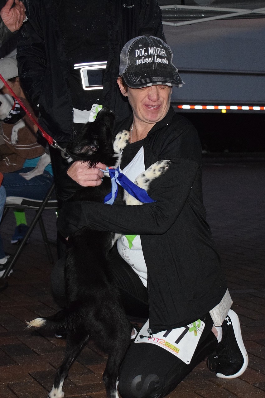 Willow, who is 6 months old, shows some love to Bradenton's Amber Charbeneau.