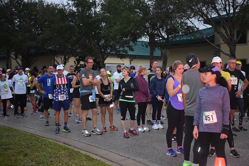 Runners get ready to take off at the starting line.