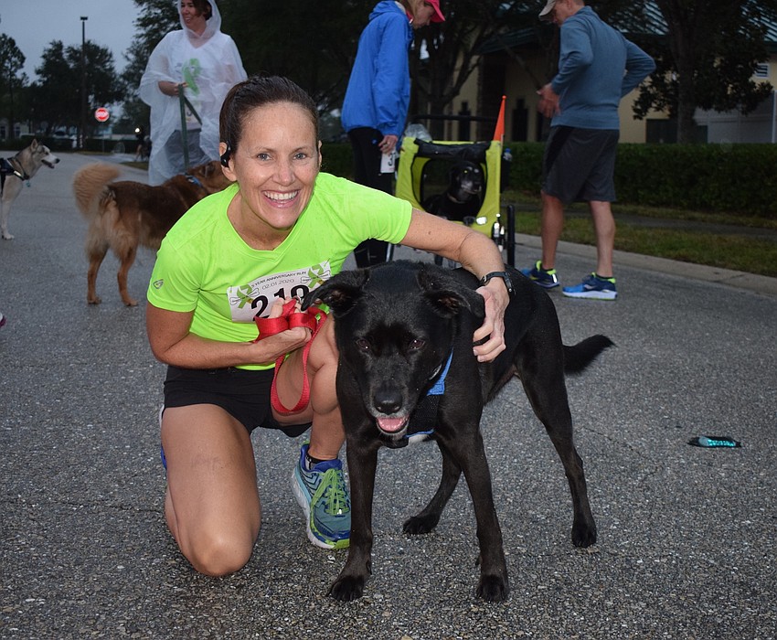 Sarasota's April Bell runs with her dog, Koda, who is 5. 