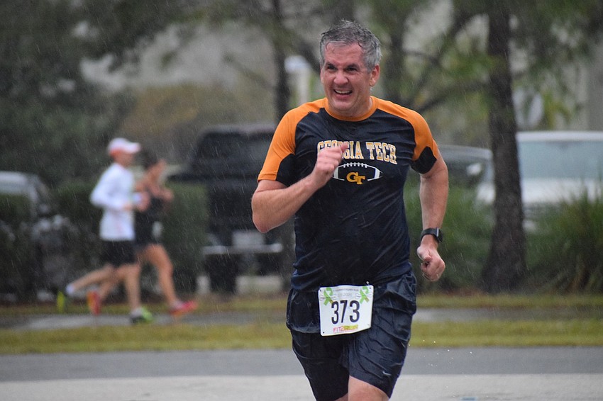 Country Club East's David Cravens runs toward the finish line. Cravens moved from Atlanta to Lakewood Ranch and says he has been 