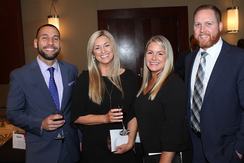 Che Sturride and Melissa Villenueve with Angela and Aaron Simpson