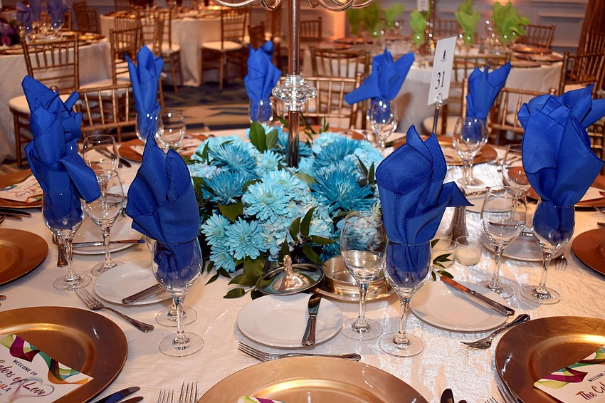 Each table is decorated with a different color scheme.